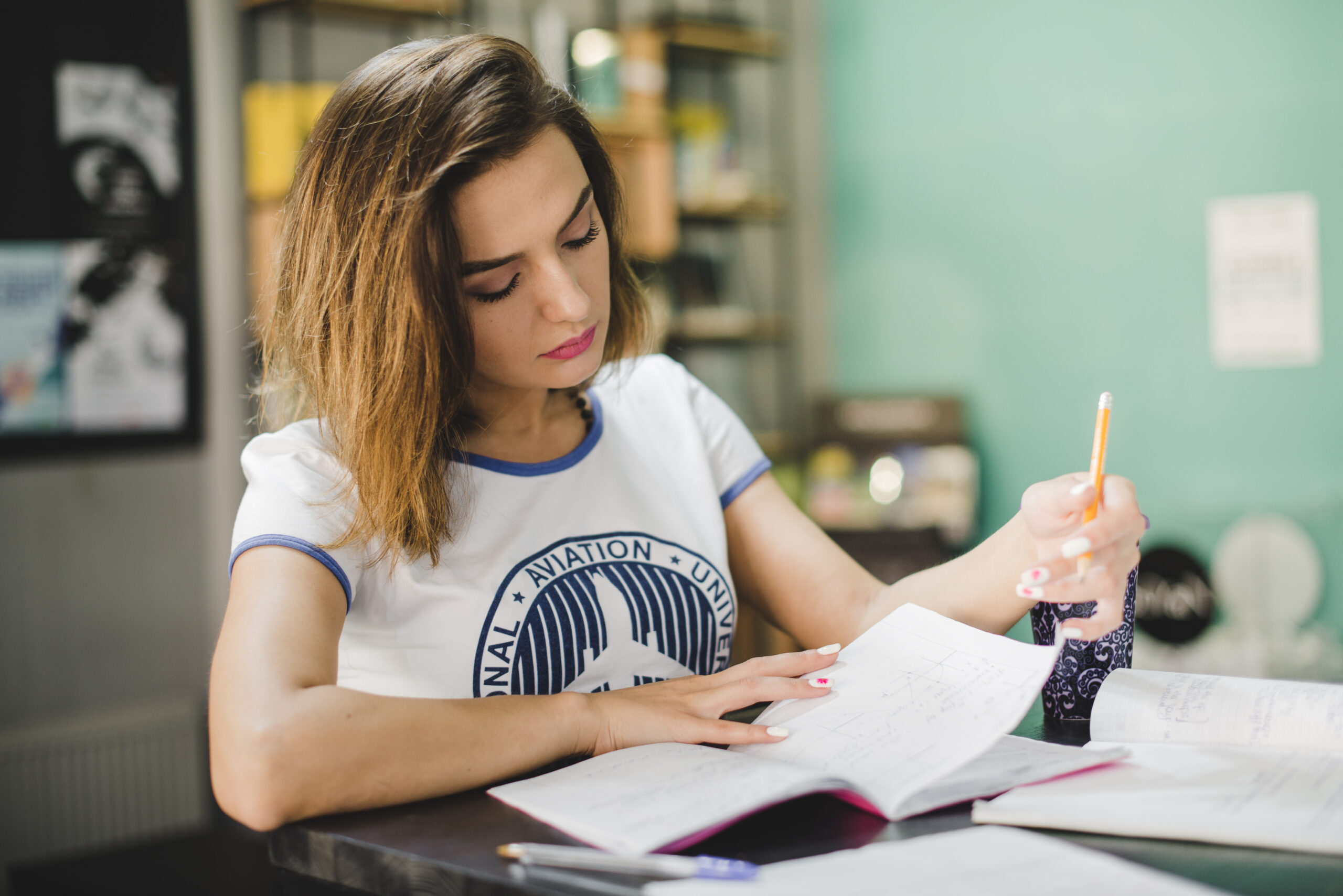 girl-sitting-table-reading
